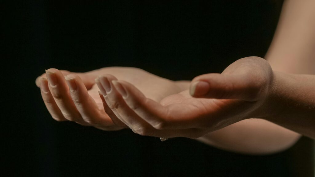 A close-up image of open hands in soft focus, ideal for themes of giving, receiving, and care.